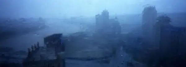 Buildings are seen through a storm in Yanji, China. The city of Yanji is a major hub for North Korean escapees and defectors. Image © Tomas van Houtryve/VII. China, 2013. Media file: 001_web_edit_borderlinenk.jpg
