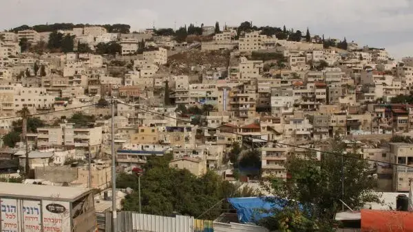 Settlers' houses in the jumbled Palestinian village of Silwan. Image by Uri Blau. Israel, 2015.
