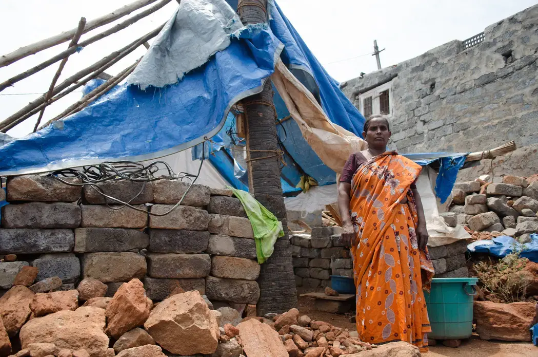 A neighbor of Mittireddi stands outside her home, which was destroyed during cyclone Hudhud but has not been rebuilt. Image by Zach Hollo. India, 2015. Media file: pc_23.jpg