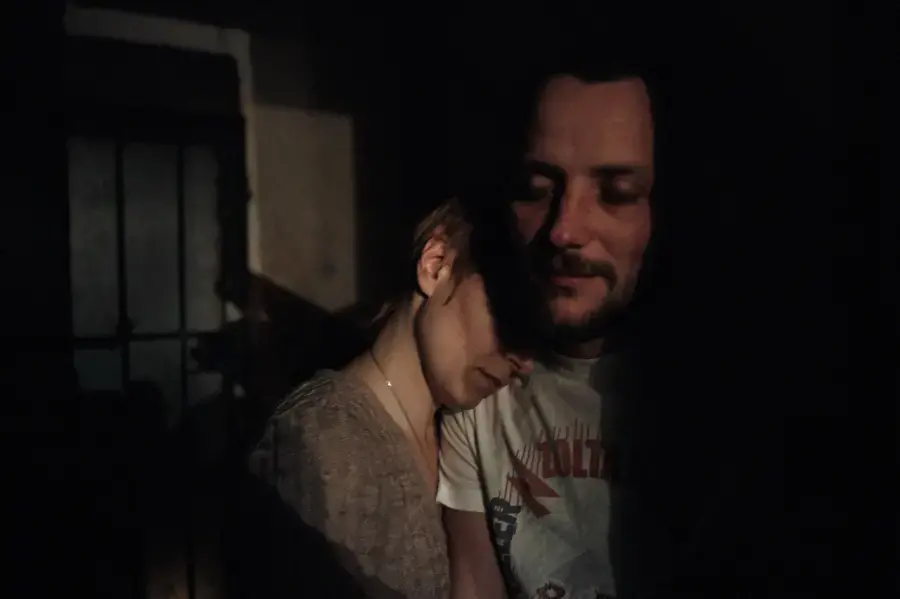 Sveta is reunited with her husband Aleksei after he spent months as POW of a separatist group. He hid his HIV status from his captors while Sveta managed to sneak his meds to him. Image by Misha Friedman. Ukraine, 2014. Media file: image.png