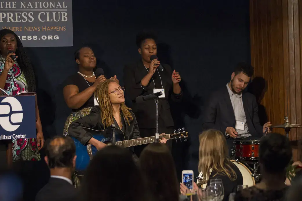 Indigo Passariello and her bandmates Ekep Nkwelle, Issayah Whitesides, Jillian Willis, and Jasmine Thomas. Passariello performed "Hands Up Don't Shoot." Image by Jin Ding. Washington, D.C., 2018. Indigo Passariello and her bandmates Ekep Nkwelle, Issayah Whitesides, Jillian Willis, and Jasmine Thomas. Passariello performed "Hands Up Don't Shoot." Image by Jin Ding. Washington, D.C., 2018.
