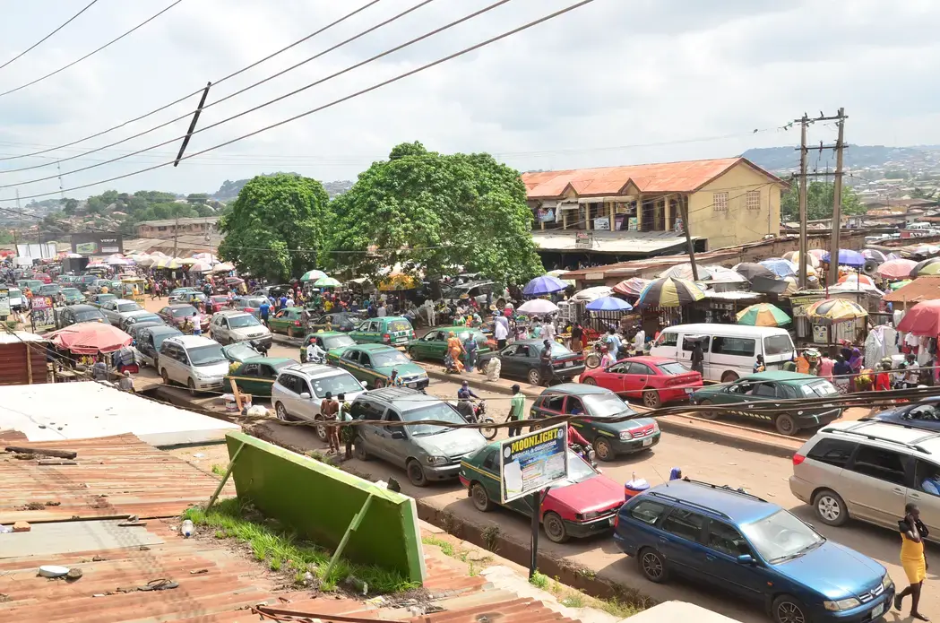 Kuto Market in Ogun State, Nigeria during lockdown relief. People rush out to get foodstuff to eat for few days. Image by Agbebiyi Adekunle Sunday / Shutterstock.com. Nigeria, 2020.