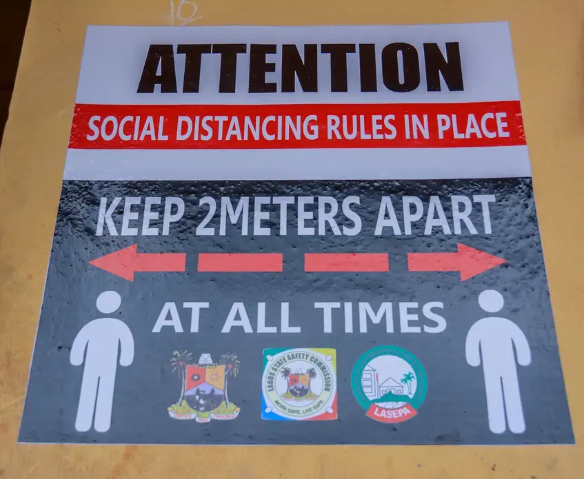 A poster on social distancing in a school in Lagos. Image by Oluwafemi Dawodu / Shutterstock. Nigeria, 2020. A poster on social distancing in a school in Lagos. Image by Oluwafemi Dawodu / Shutterstock. Nigeria, 2020.