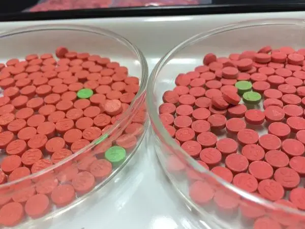 'Ya ba' pills, which are a mixture of methamphetamine and caffeine. Image from Wikimedia Commons (CC BY 2.0).