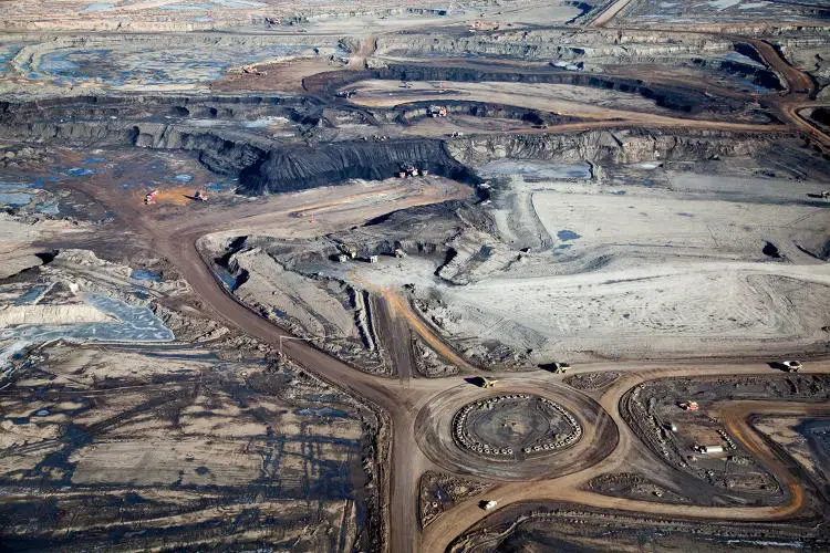 Excavating bitumen at the Syncrude Mildred Lake mining site. Giant tires line traffic circle. Image by Alex MacLean. Canada, 2014. Media file: 3029771-slide-s-tar-sands-09.jpg