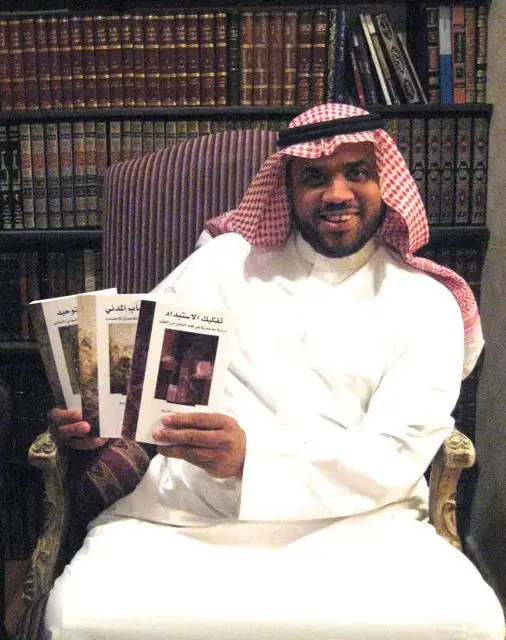 Mohammed Abdul Kareem with his three books, the last one banned in Saudi. Image by Caryle Murphy. Saudi Arabia, 2014. Media file: mohammed_abdulkareem_1.jpg