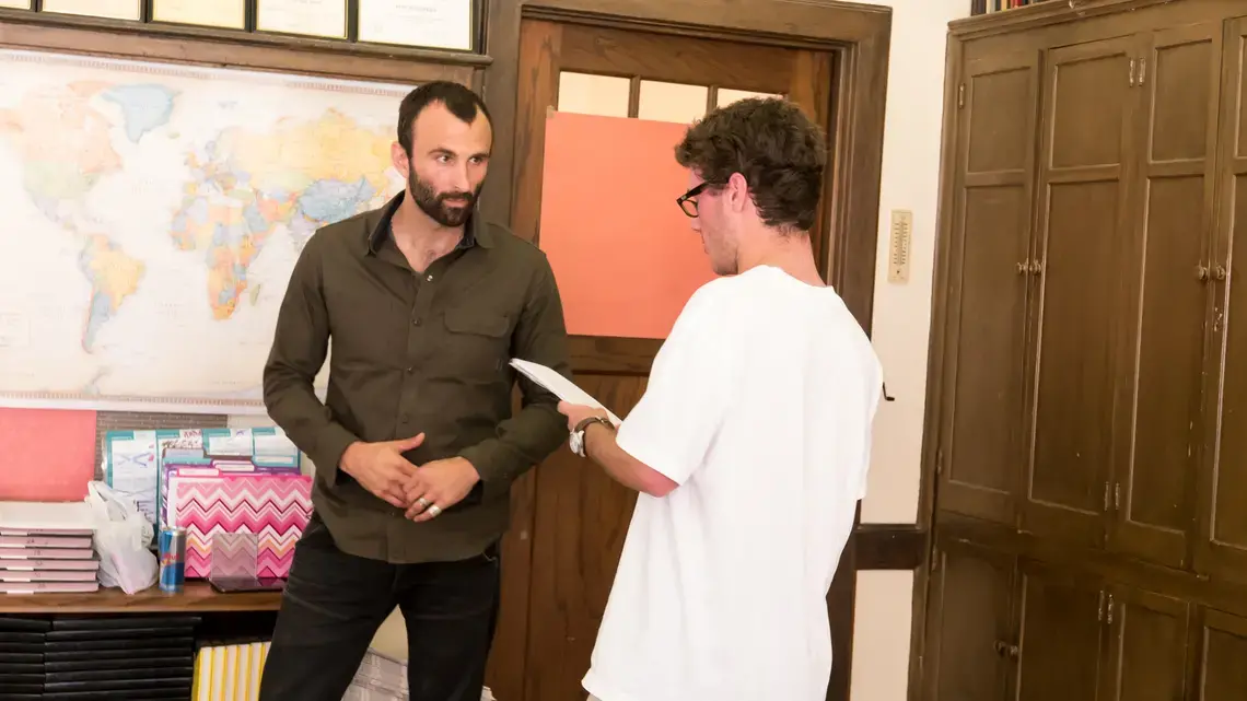 RJ Reynolds High School student Hill Douglas asks Pulitzer Center grantee Jason Motlagh about his reporting on the textiles industry in Bangladesh as part of Weaving Connections, a documentary filmmaking program developed as part of Pulitzer Center's NewsArts initiative. Image by Fareed Mostoufi. United States, 2017. RJ Reynolds High School student Hill Douglas asks Pulitzer Center grantee Jason Motlagh about his reporting on the textiles industry in Bangladesh as part of Weaving Connections, a documentary filmmaking program developed as part of Pulitzer Center's NewsArts initiative. Image by Fareed Mostoufi. United States, 2017.