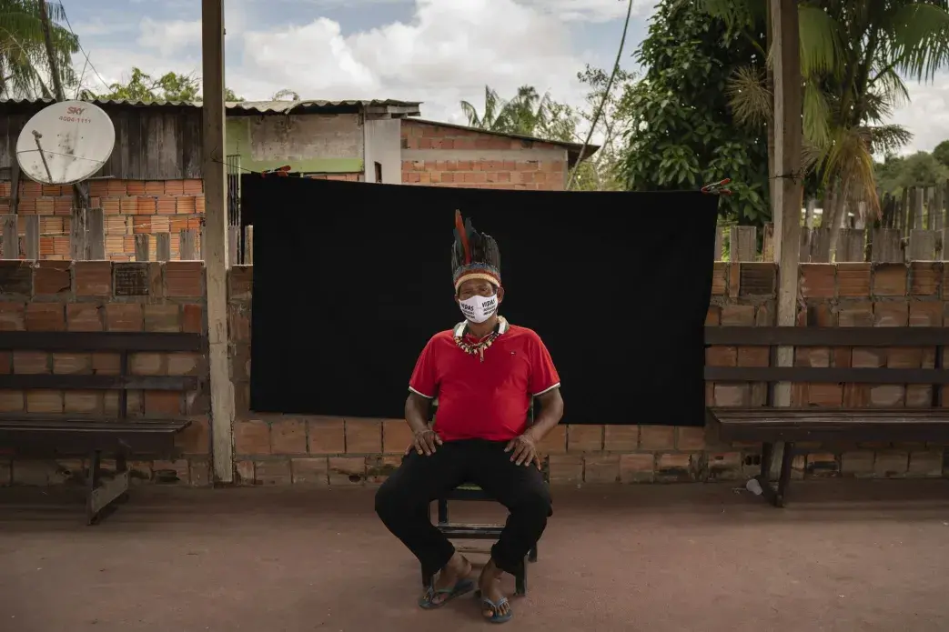 Indigenous leader Jose Augusto, 48, of the Miranha indigenous ethnic group, poses for a portrait wearing a face mask amid the spread of the new coronavirus, at the Park of Indigenous Nations community in Manaus, Brazil, Thursday, May 28, 2020. His mask reads in Portuguese: "Indigenous lives matter." Image by Felipe Dana / AP Photo. Brazil, 2020. Indigenous leader Jose Augusto, 48, of the Miranha indigenous ethnic group, poses for a portrait wearing a face mask amid the spread of the new coronavirus, at the Park of Indigenous Nations community in Manaus, Brazil, Thursday, May 28, 2020. His mask reads in Portuguese: "Indigenous lives matter." Image by Felipe Dana / AP Photo. Brazil, 2020.