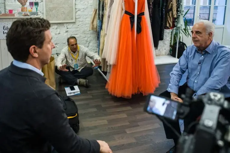PBS NewsHour correspondent William Brangham (l) and Science magazine's Jon Cohen (seated) jointly interview UN Envoy Michel Kazatchkine for TV and print stories about HIV/AIDS in Russia. Image by Misha Friedman. Russia, 2017. PBS NewsHour correspondent William Brangham (l) and Science magazine's Jon Cohen (seated) jointly interview UN Envoy Michel Kazatchkine for TV and print stories about HIV/AIDS in Russia. Image by Misha Friedman. Russia, 2017.