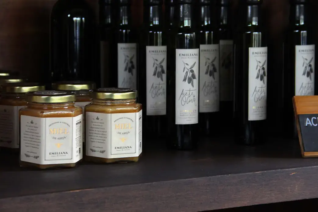 Honey and olive oil sold at Emiliana Vineyards as a part of the Social Responsibility Program. Image by Taylor Lord. Chile, 2017. Honey and olive oil sold at Emiliana Vineyards as a part of the Social Responsibility Program. Image by Taylor Lord. Chile, 2017.
