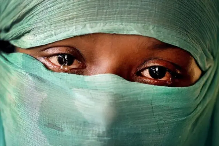 F, 22, who says she was raped by members of Myanmar’s armed forces in June and again in September, cries as she speaks to The Associated Press in her tent in Kutupalong refugee camp in Bangladesh. Image by Wong Maye-E. Bangladesh, 2017. Media file: 800_4.jpg