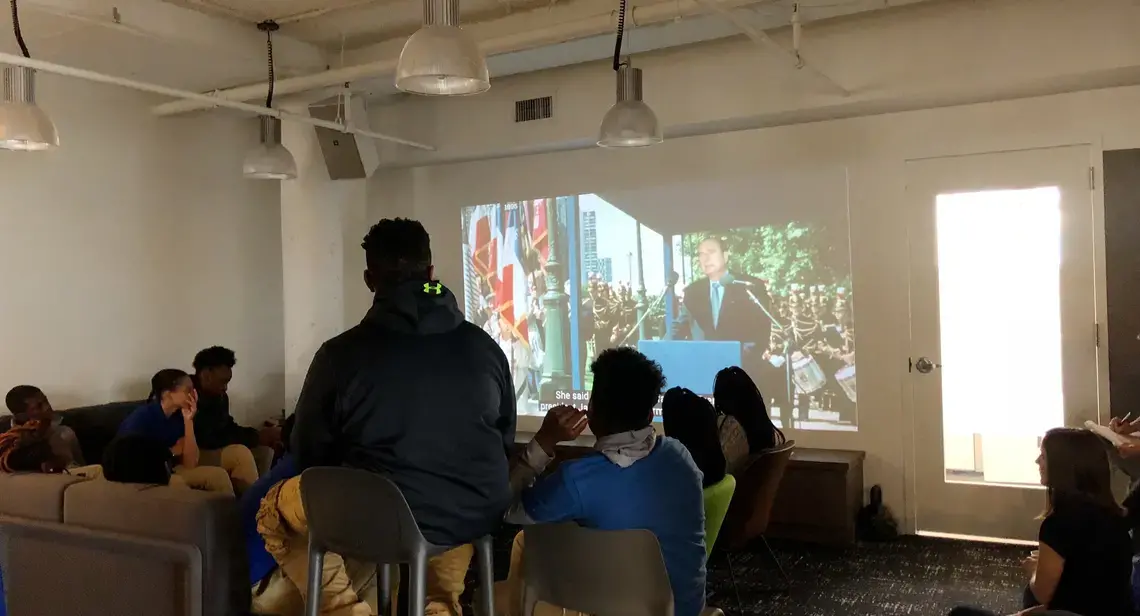 Wheatley Education Campus students analyze the A-Roll and B-Roll used in grantee Sarah Wildman's video "Marine Le Pen: France's Trump Is on the Rise" at the Vox Washington, D.C. office. Image by Kayla Edwards. United States, 2018. Media file: cover.jpg