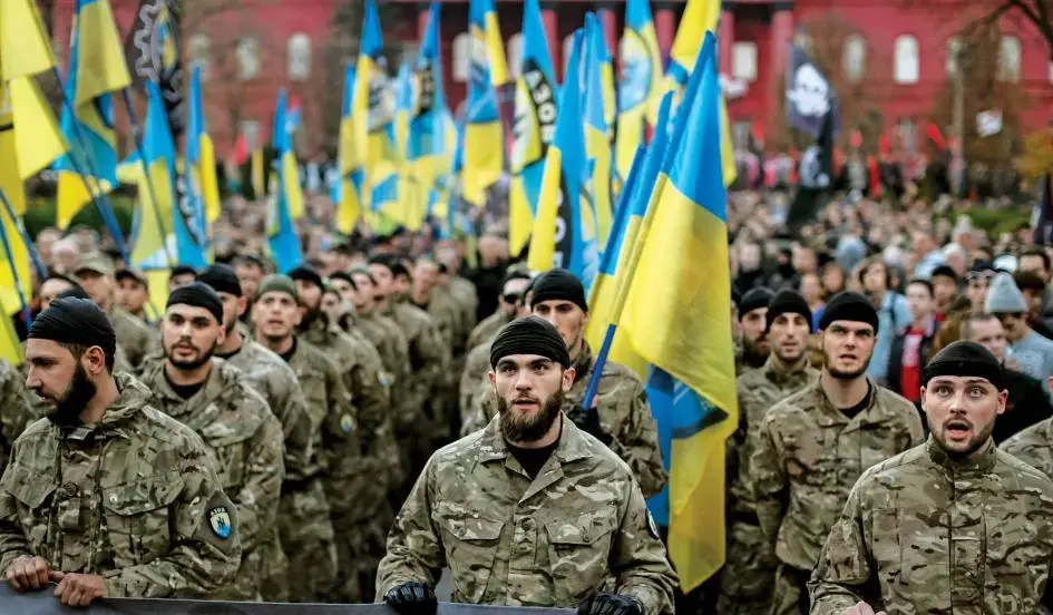 Soldiers of the Ukrainian self-defense battalion Azov take part in a procession to mark the Day of Ukrainian Cossacks to honor the role of the movement in Ukraine’s history, in Kiev on October 14, 2014. Image by Gleb Garanich/Reuters. Ukraine, 2014. Media file: 0424ukraine01.jpg