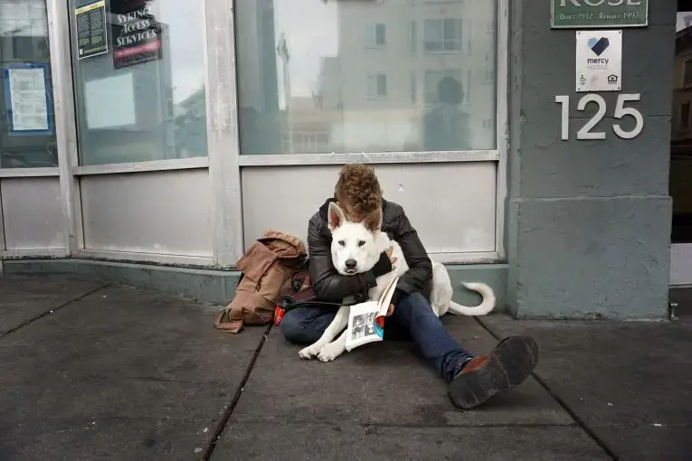 An image taken by an ex-inmate as part of Brian Frank's "Visions of Justice" project. The image captures a young man and his dog on the streets of San Francisco. Image by Chris Shurn. United States, 2018. An image taken by an ex-inmate as part of Brian Frank's "Visions of Justice" project. The image captures a young man and his dog on the streets of San Francisco. Image by Chris Shurn. United States, 2018.
