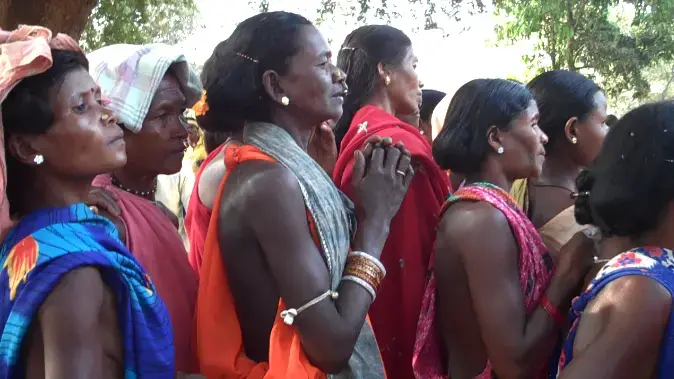 Adivasi women at a festival intended to bring their community together with the police, with whom the Naxalites or Maoists often clash in bloody battles. Image by Simone Ahuja. India, 2013. Media file: adivasi_women_at_police_festival.png