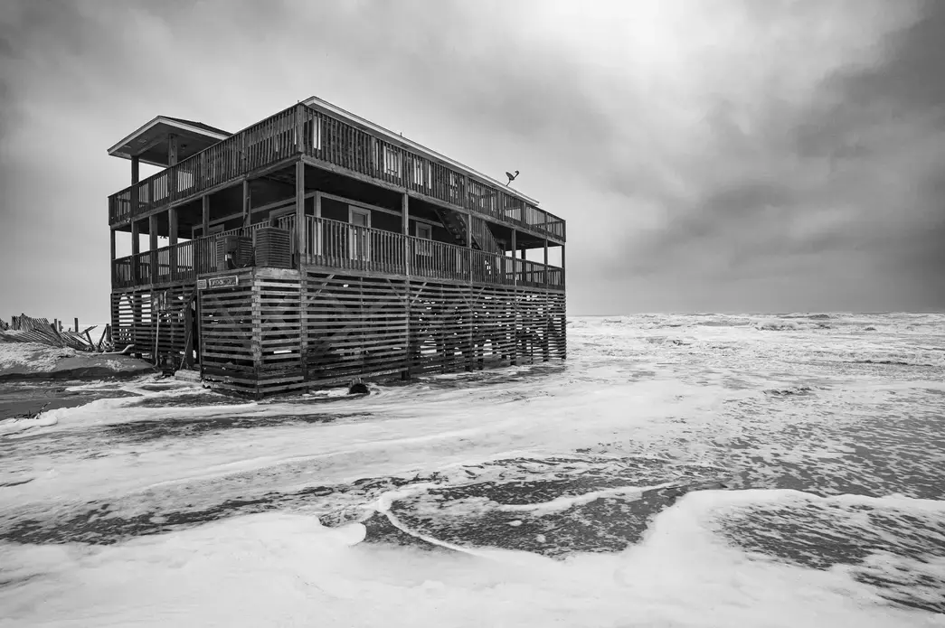 Surf washes around an Outer Banks home during a nor’easter in November 2019. Image by Jared Lloyd. United States, 2019. Surf washes around an Outer Banks home during a nor’easter in November 2019. Image by Jared Lloyd. United States, 2019.