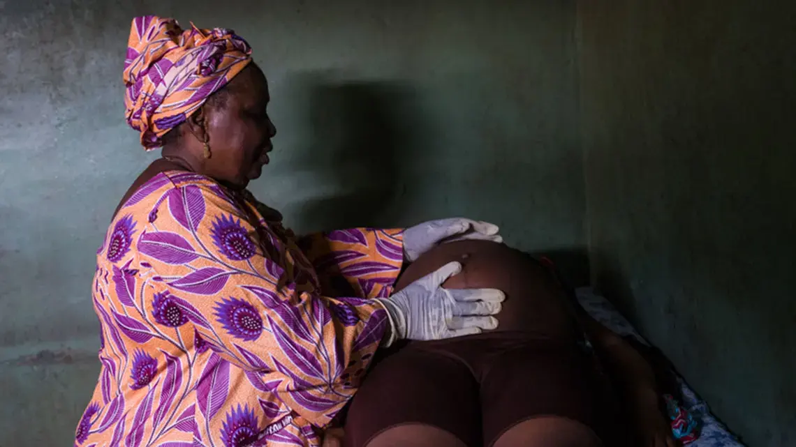 Woman examining pregnancy in Lagos. Image by Misha Friedman. Nigeria, 2018.