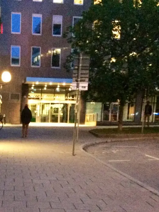 A man approaches one of the few women lingering on Malmskillinsgatan, the closest thing in Stockholm to a red-light district. Image by Michelle Goldberg. Sweden, 2014. Media file: malmskillinsgatan.jpg