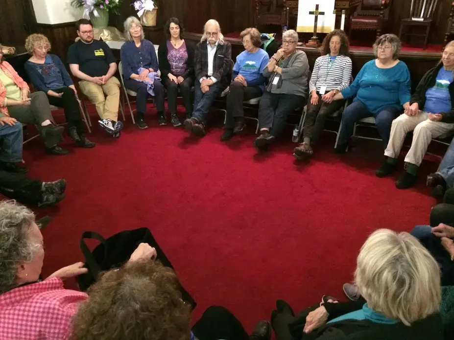 Leverett, Mass. and Letcher County, Ky. residents end their discussion with a moment of silence. Image by Richie Davis. United States, 2018.