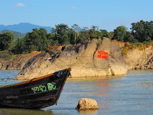 Graffiti near the Myitsone Dam. Image by Doug Bock Clark. Myanmar, 2017. Graffiti near the Myitsone Dam. Image by Doug Bock Clark. Myanmar, 2017.