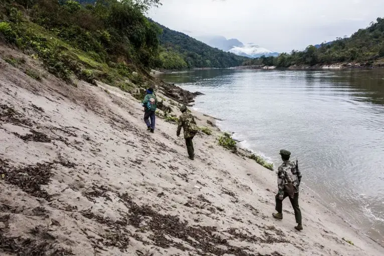 Villagers and Kachin Independence Army officers walk into the Chipwi dam project area, which was stopped in 2012 due to fighting in Chipwi, Kachin State, Myanmar. Image by Hkun Lat. Myanmar, 2019. Villagers and Kachin Independence Army officers walk into the Chipwi dam project area, which was stopped in 2012 due to fighting in Chipwi, Kachin State, Myanmar. Image by Hkun Lat. Myanmar, 2019.