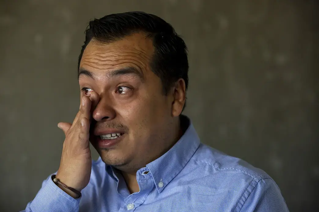 Jesus Ortiz, 37, tears up while talking about being separated from his wife, new daughter and stepchildren, who live in the United States. He created the group Migrated Too “to teach in both sides of the border that human migration brings a lot of benefits.” Image by Erika Schultz. Mexico, 2019.