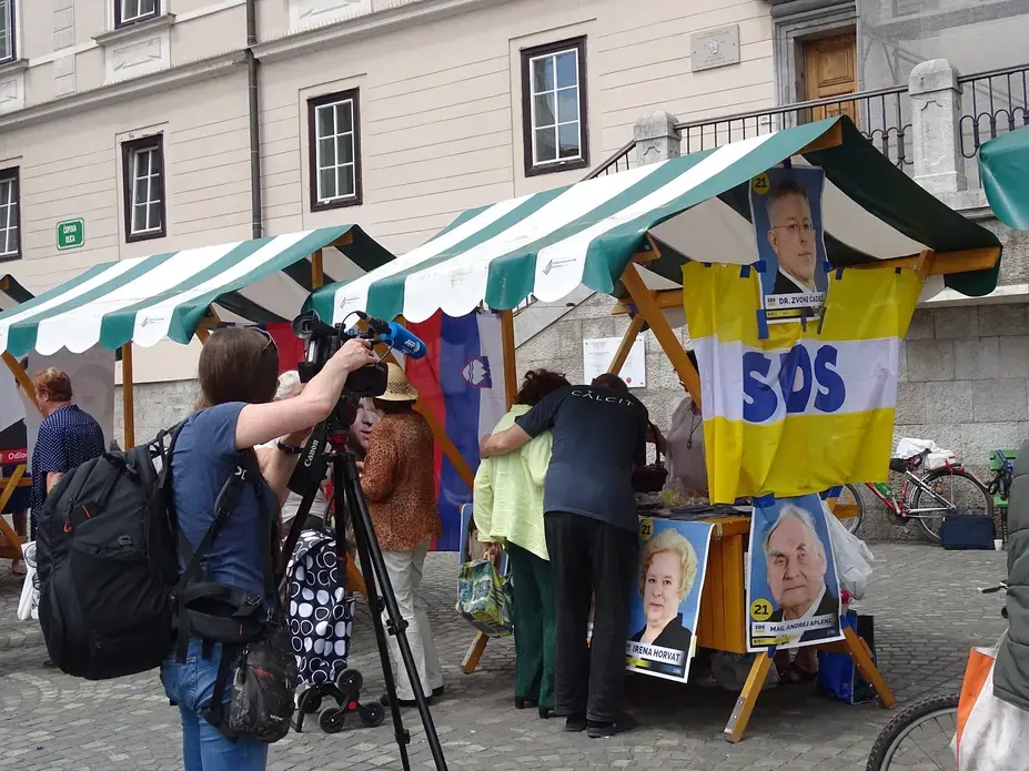 Media focuses their attention on SDS campaigning in the city center. SDS won the election with nearly 25 percent of the vote. Image by Olivia Watson. Slovenia. 2018.