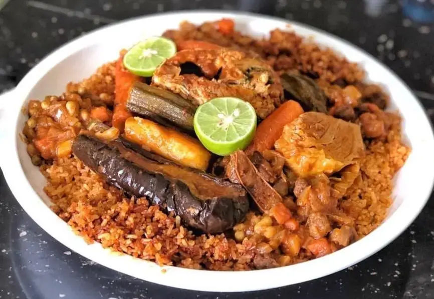 Thieboudienne, the most famous dish of Senegal. Image by Amy Nye. Senegal, 2019.