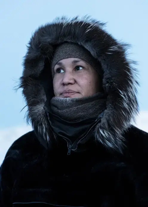 Ivalo Olsen, originally from Ilulissat, currently works as the village teacher in Oqaatsut. She dreams of becoming a psychologist, which means she would have to study in Denmark or elsewhere. Image by Jonas Bendiksen. Greenland, 2018.