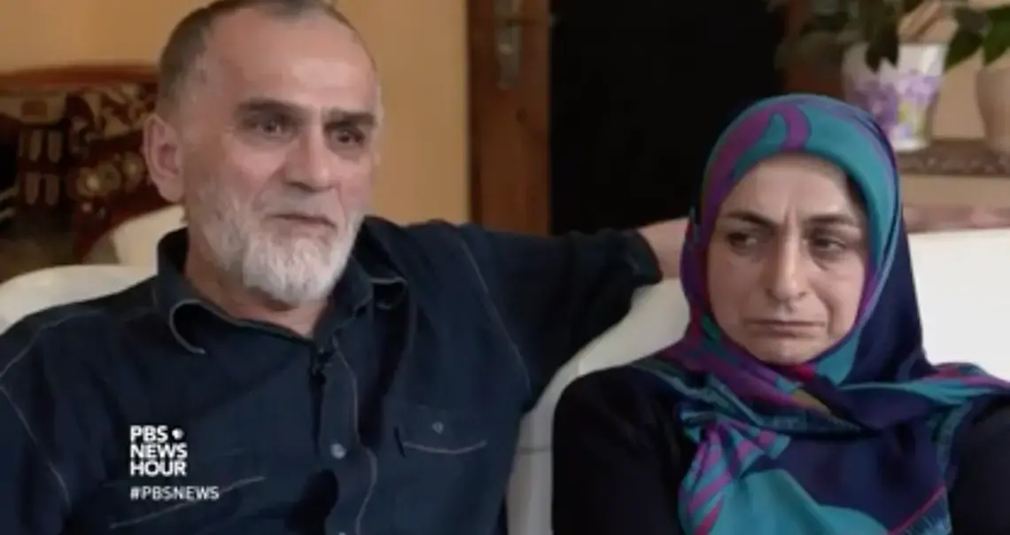 Kazim Nurmagometov and his wife talk to PBS about their son, Marat, who left Dagestan to go fight with ISIS. Image from PBS NewsHour. Russia, 2017. Kazim Nurmagometov and his wife talk to PBS about their son, Marat, who left Dagestan to go fight with ISIS. Image from PBS NewsHour. Russia, 2017.