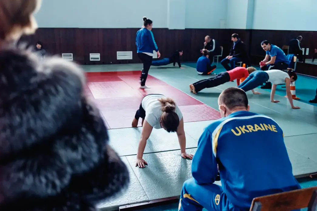 Prospective female police recruits lining up for strentgh and endurance exams at Kiev Police Academy. Image by Misha Friedman. Ukraine, 2015. Media file: mf-1.jpg