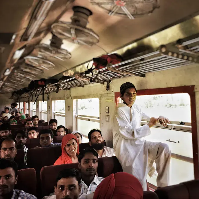 Kashmiri's travel by train near Sopore, a town in the Baramulla district on the Northwestern edge of the Kashmir valley. The 345 km rail line from Baramulla to Jammu, which is still under construction, will eventually connect the disputed territory of Jammu and Kashmir with the rest of India. Image by Sara Hylton. India, 2016. Media file: img_3119.jpg