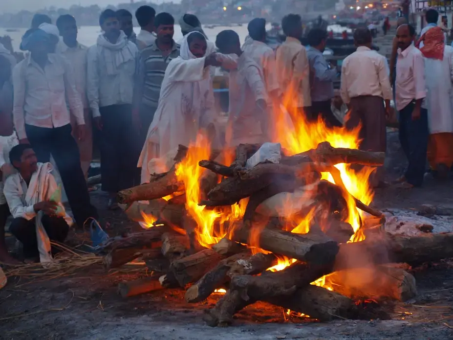 Hindus believe that cremation in Varanasi frees them from the cycle of birth, death, and reincarnation. Image by George Black. India, 2016. Hindus believe that cremation in Varanasi frees them from the cycle of birth, death, and reincarnation. Image by George Black. India, 2016.