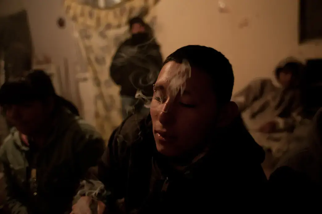 Diego Montejano hangs out in the Noveno barrio, a barrio that had previously been his own's rival, in 2011. Montejano was slowly able to escape gang life with the help of community outreach groups and the support of friends. Image by Dominic Bracco. Mexico, 2011. Media file: 01bracco.jpg