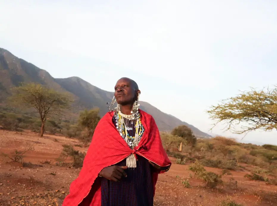 Maasai women prepare the slaughter of a sheep to ask for rain. A recent drought and the dislocation of their traditional grazing land have created difficulties—making it harder to feed a smaller number of cattle. Image by Thomas Dworzak. Tanzania, 2018.
