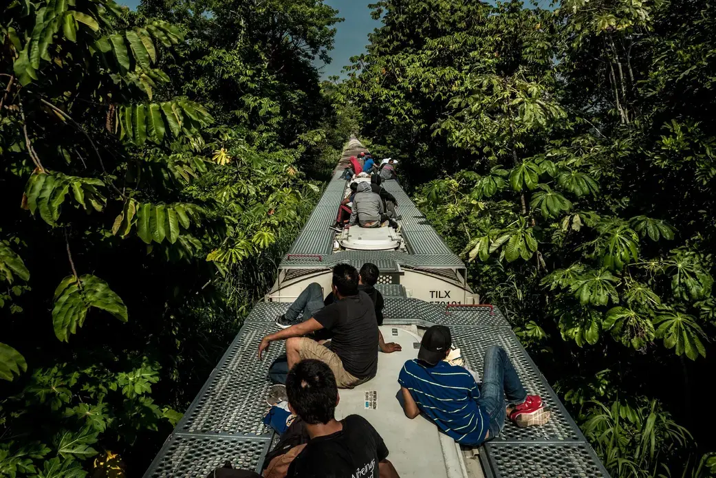 Migrants from Central America riding north on the Bestia freight rail line. Image by Meridith Kohut. Tabasco, Mexico, 2020. Migrants from Central America riding north on the Bestia freight rail line. Image by Meridith Kohut. Tabasco, Mexico, 2020.