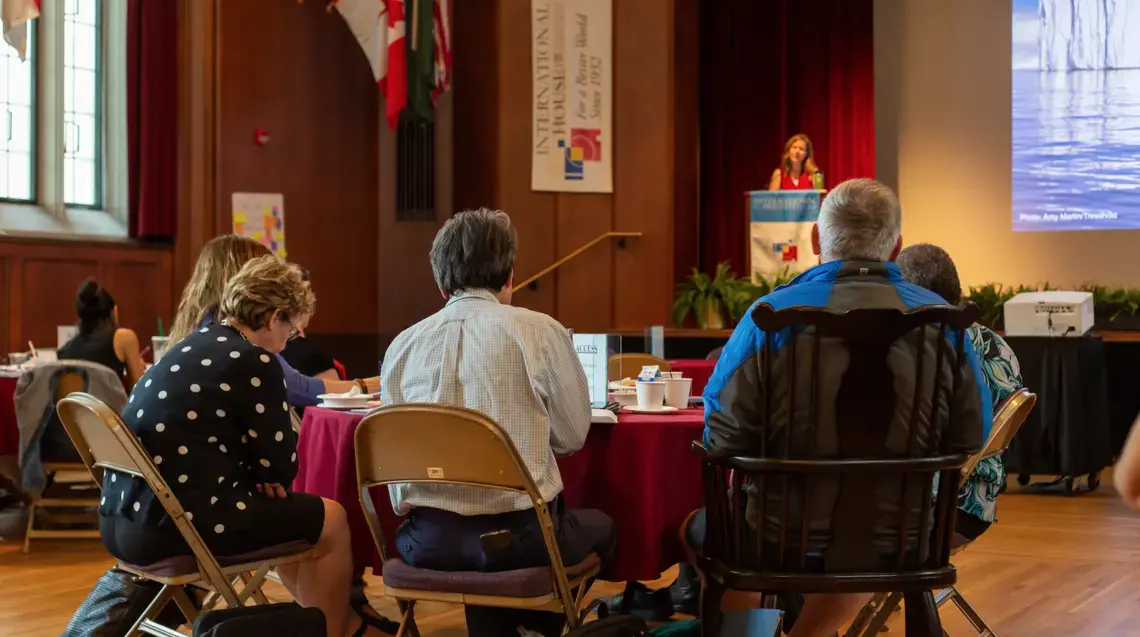 Educators listen intently as Pulitzer Center grantee Amy Martin explains her reporting on the melting Arctic. Image by Claire Seaton. United States, 2019.