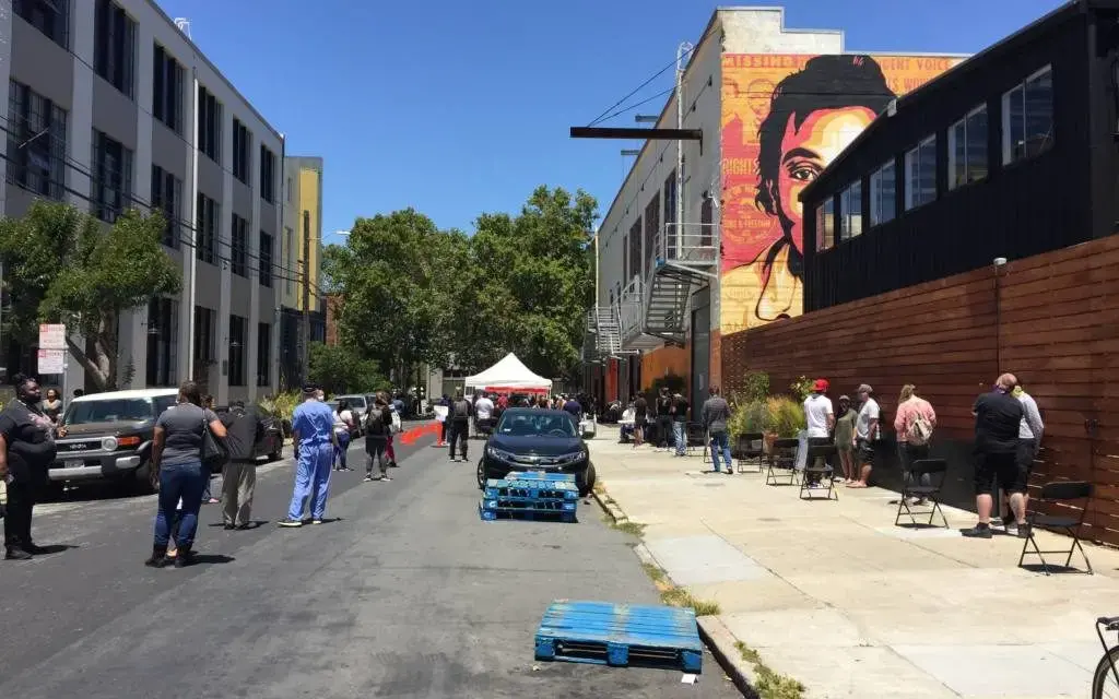 People waiting in line at the Mission COVID-19 mobile testing site at 701 Alabama Street on July 9, 2020. Image by Michael Toren. United States, 2020. People waiting in line at the Mission COVID-19 mobile testing site at 701 Alabama Street on July 9, 2020. Image by Michael Toren. United States, 2020.