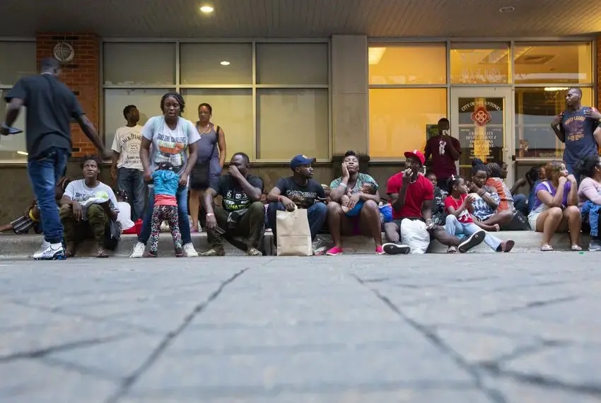 Migrants at a resource center in downtown San Antonio are given food and a bag with basic hygiene products, then escorted to a nearby shelter to spend the night. Image by Marjorie Kamys Cotera. United States, 2019. Migrants at a resource center in downtown San Antonio are given food and a bag with basic hygiene products, then escorted to a nearby shelter to spend the night. Image by Marjorie Kamys Cotera. United States, 2019.