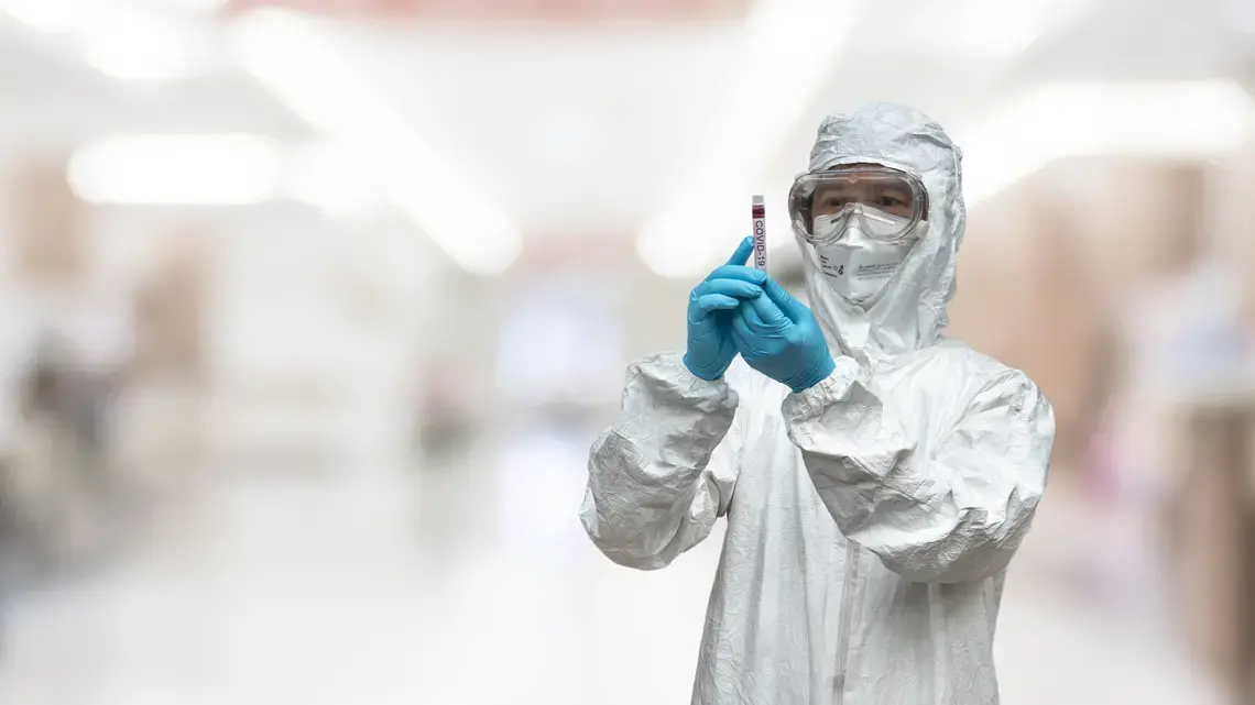 A lab technician scientist in PPE. Image by Chinnapong / Shutterstock. A lab technician scientist in PPE. Image by Chinnapong / Shutterstock.