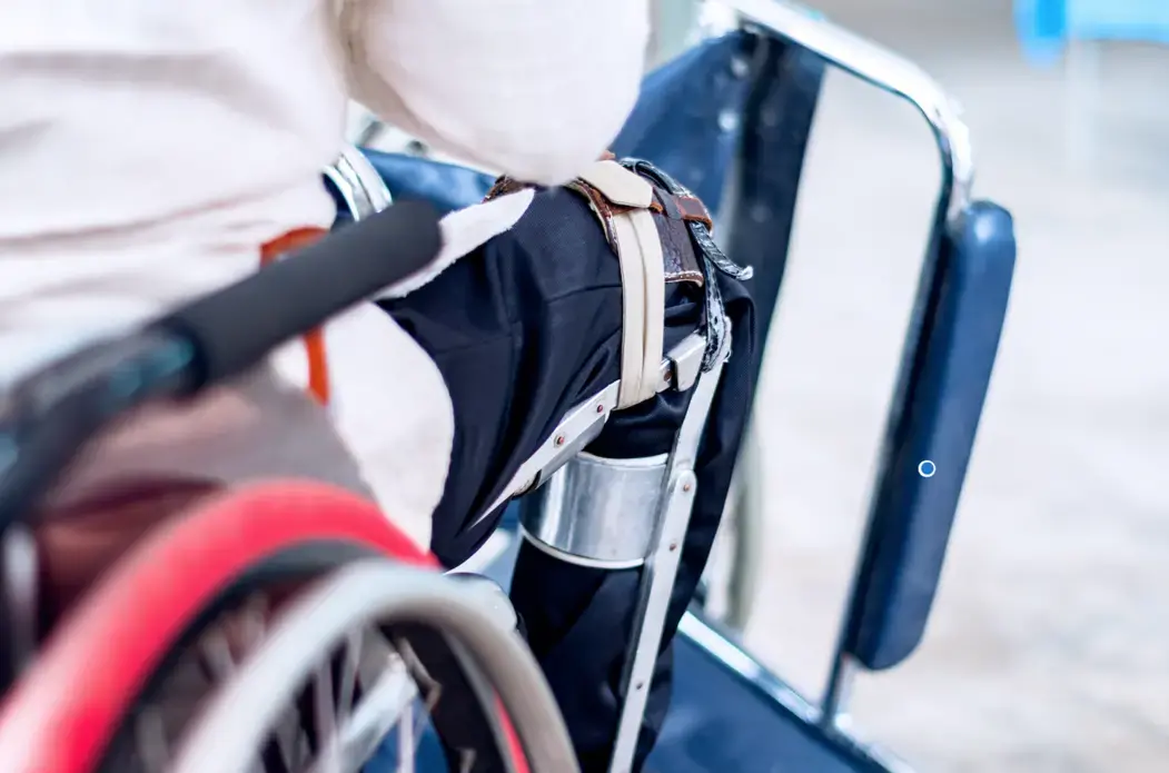 A man sitting on the wheelchair with an old polio knee brace, closeup view. Image by Ruchuda Boonplien / Shutterstock. Undated. A man sitting on the wheelchair with an old polio knee brace, closeup view. Image by Ruchuda Boonplien / Shutterstock. Undated.
