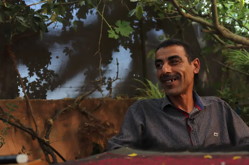 Ziad and his family once had plenty of water to irrigate their land and sustain their home. Today, his village of Burqin faces severe water shortages. Much of the water that does exist is contaminated due to untreated sewage from settlements and the Palestinian cities of Ramallah and Nablus nearby and chemical waste that's deposited in the area. The village has one of the highest rates of cancer in the West Bank. Image by Carly Graf. Palestine, 2019. Ziad and his family once had plenty of water to irrigate their land and sustain their home. Today, his village of Burqin faces severe water shortages. Much of the water that does exist is contaminated due to untreated sewage from settlements and the Palestinian cities of Ramallah and Nablus nearby and chemical waste that's deposited in the area. The village has one of the highest rates of cancer in the West Bank. Image by Carly Graf. Palestine, 2019.