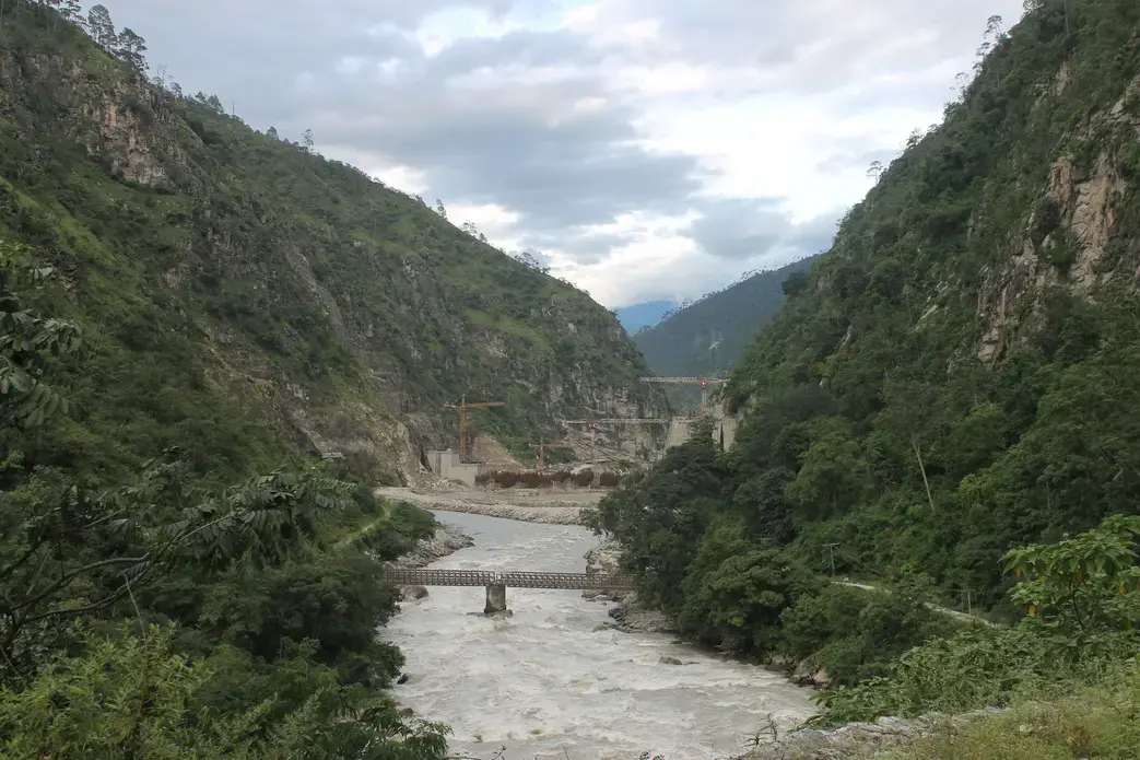 The Punatsangchhu River is the hotspot for hydropower construction in Bhutan: Pictured is the new mega Punatsangchhu-II hydroelectric project, delayed extensively by geologic challenges. Image by Emma Johnson. Bhutan, 2019. The Punatsangchhu River is the hotspot for hydropower construction in Bhutan: Pictured is the new mega Punatsangchhu-II hydroelectric project, delayed extensively by geologic challenges. Image by Emma Johnson. Bhutan, 2019.