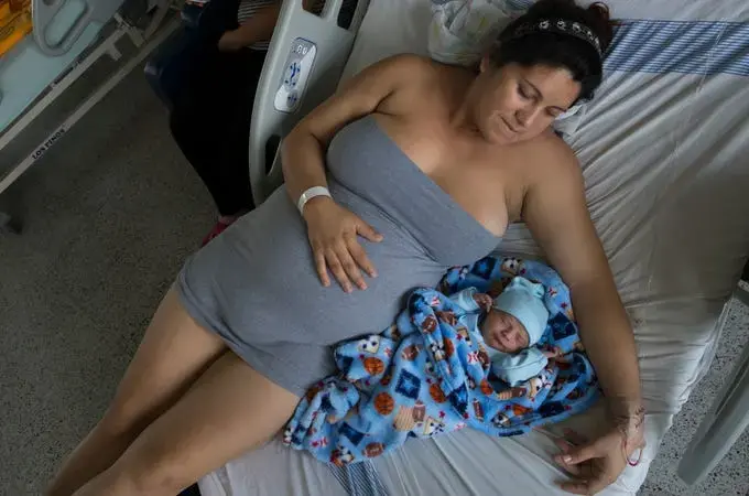 Maria Daniela Castro from Caracas with her newborn. In Colombia, due to the exodus of more than 3.7 million Venezuelans from their country, 24,000 Venezuelan babies have been born stateless since the beginning of the crisis, according to June government data. Image by Megan Janetsky. Colombia, 2019. Maria Daniela Castro from Caracas with her newborn. In Colombia, due to the exodus of more than 3.7 million Venezuelans from their country, 24,000 Venezuelan babies have been born stateless since the beginning of the crisis, according to June government data. Image by Megan Janetsky. Colombia, 2019.