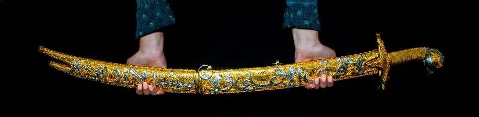 The Zulfiqar is a mystic sword connected to the Prophet Mohammad and his son-in-law Imam Ali ibn Abi Talib. Image by Jake May. XXCountry, 2019. The Zulfiqar is a mystic sword connected to the Prophet Mohammad and his son-in-law Imam Ali ibn Abi Talib. Image by Jake May. XXCountry, 2019.