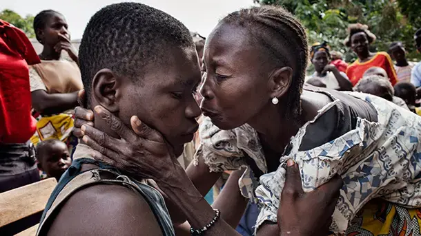 A mother welcomes her son home after he escaped from kidnappers. Image by Marcus Bleasdale, Central African Republic, 2013. Media file: bleasdale2-dl_jpg_610x343_crop_upscale_q85.jpg