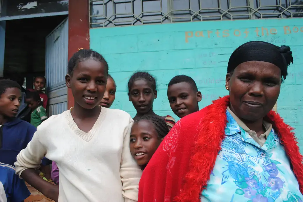 A mother in southern Ethiopia (right) underwent female genital mutilation as a young woman. But because of KMG's work, her daughter (left) and other girls in their community will not undergo the harmful practice. Image by Amy Yee. Ethiopia, 2016. A mother in southern Ethiopia (right) underwent female genital mutilation as a young woman