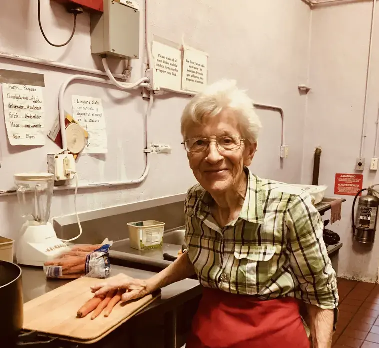 Sister Beatrice Donnellan works in the kitchen at Casa Vides, the migrant shelter she directs. Image by Lily Moore-Eisenberg. United States, 2019.