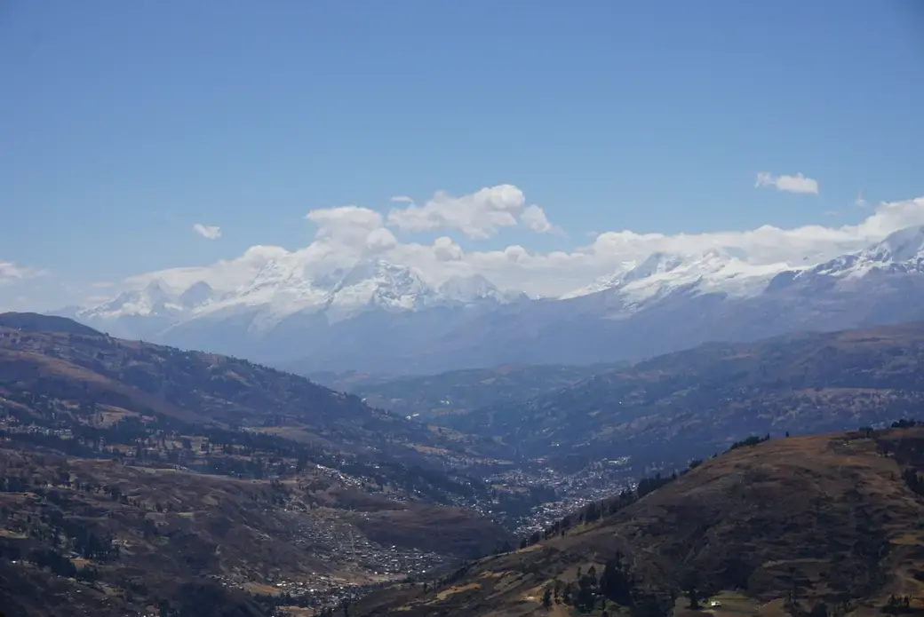 Huaraz below the snow-covered peaks of the Cordillera Blanca, the second tallest mountain range after the Himalayas. Image by Audrey Fromson. Peru, 2019.