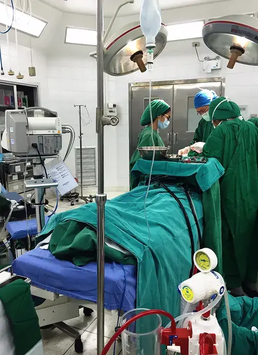 Dr. Greechart (middle) of Yanhee International Hospital performs a two-hour facial feminization surgery on a transgender patient. Image by Julia Boccagno. Thailand, 2015. Media file: image1_3.jpg